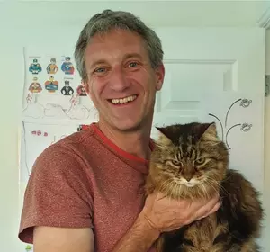 Chris Burghes holding a cat