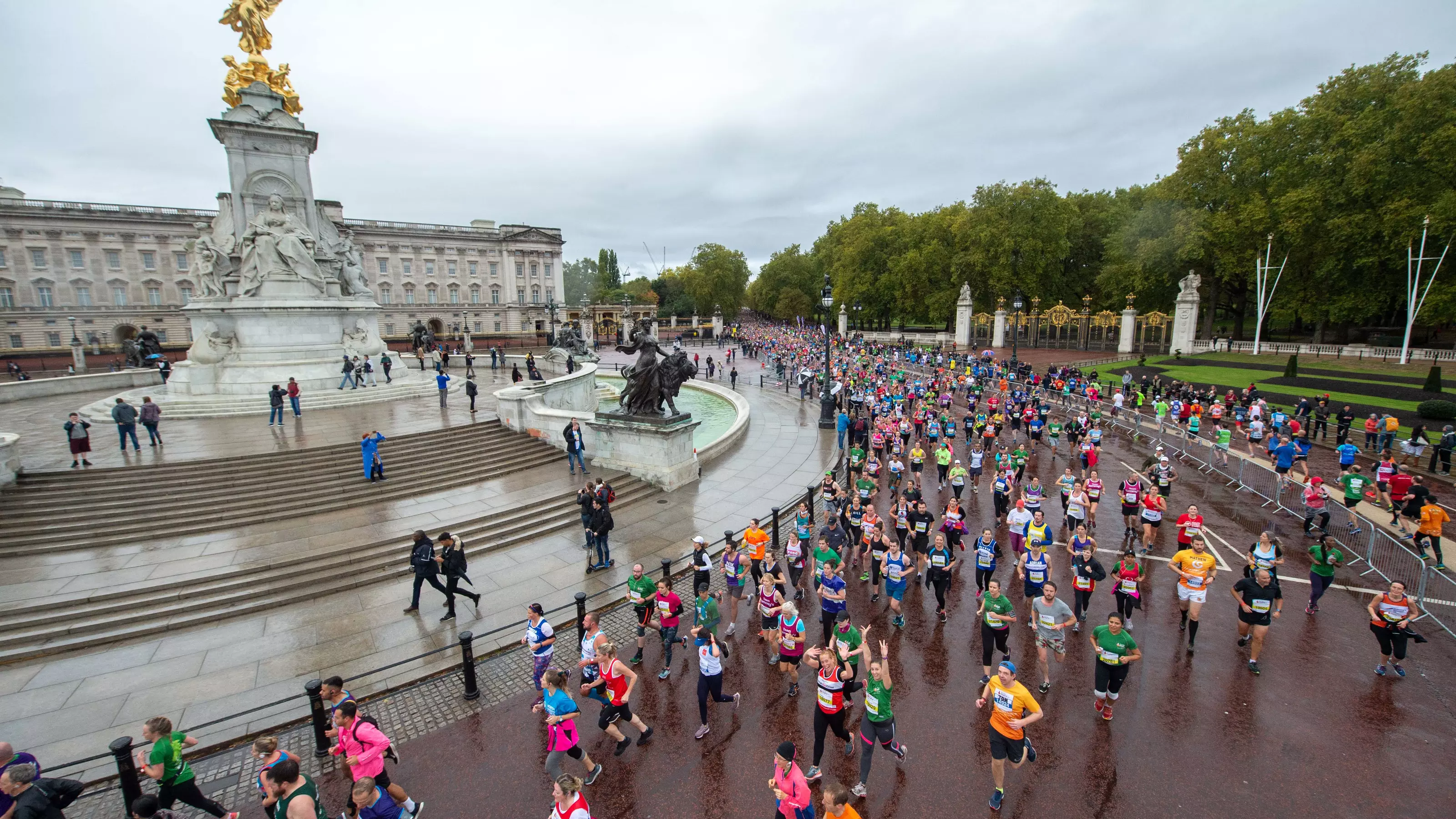 Marathon runners running past Buckingham Palace as part of the Royal Park half 
