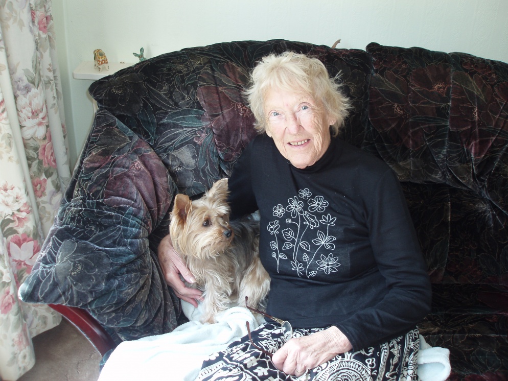 Women sitting on a sofa with pet dog