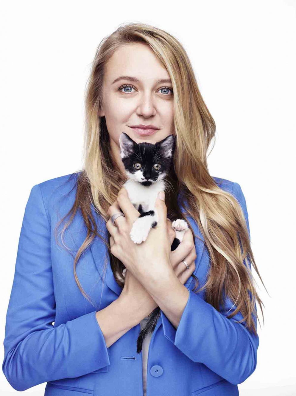 Actress Emily Head with black and white kitten in her arms