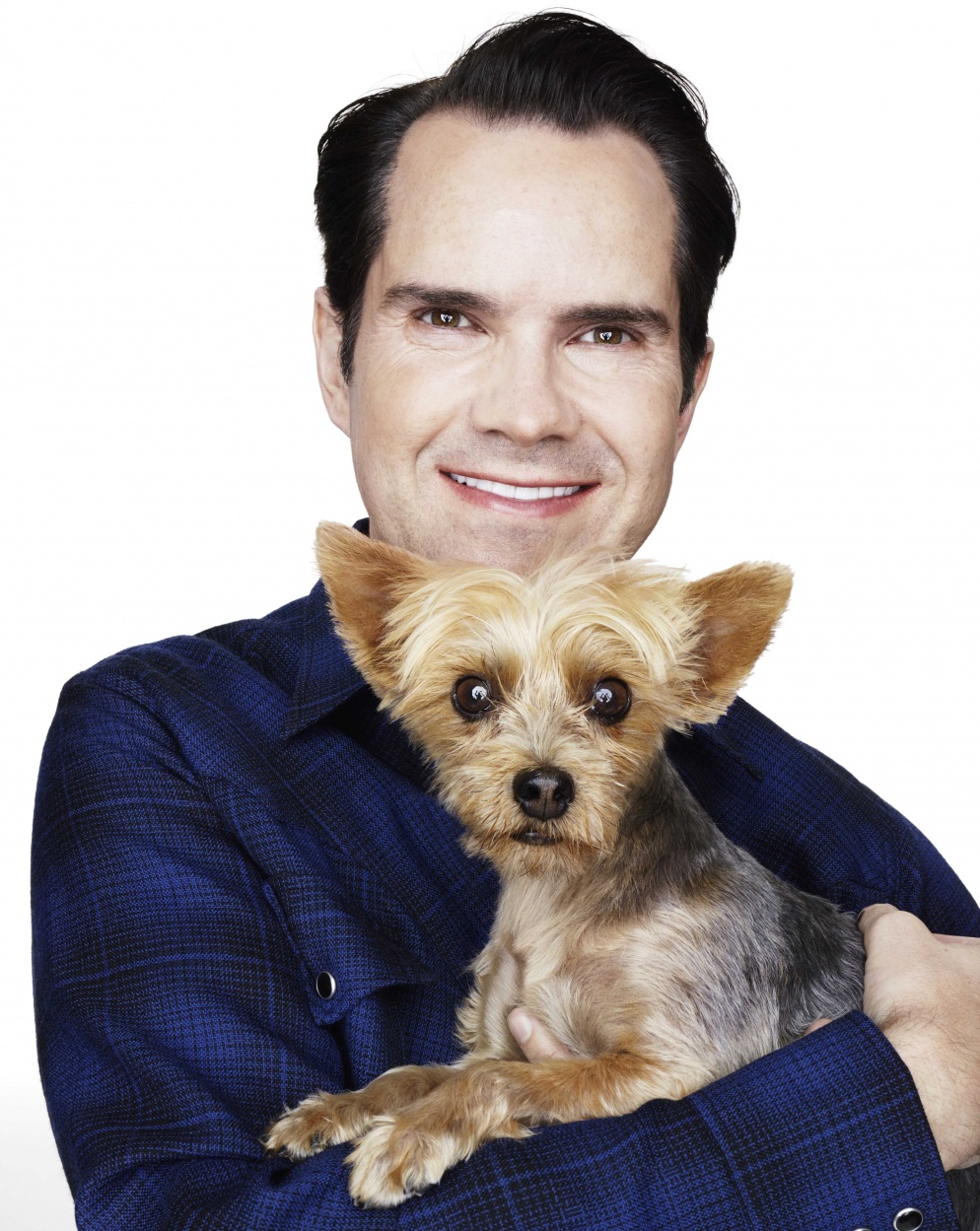 Jimmy Carr with Yorkshire terrier in arms