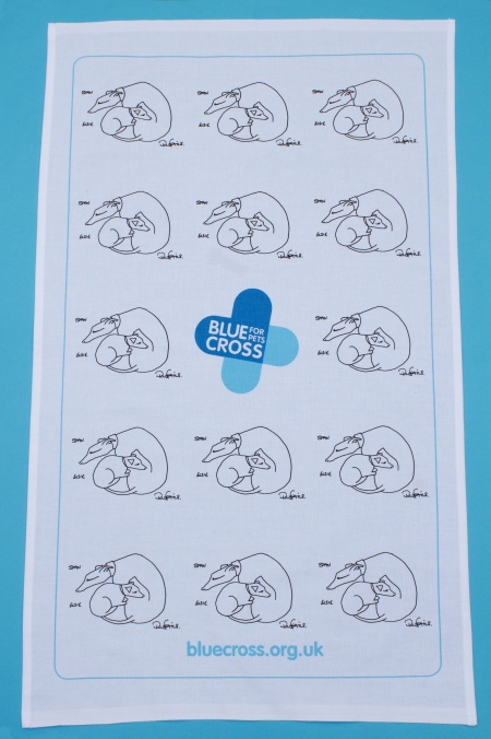 a tea towel with illustrations of dogs