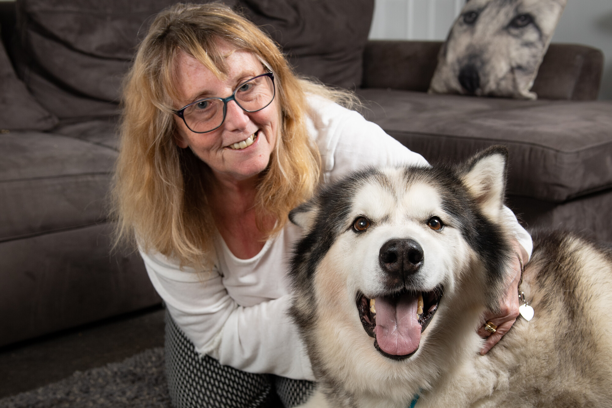 Karen sitting down with her arms around Storm