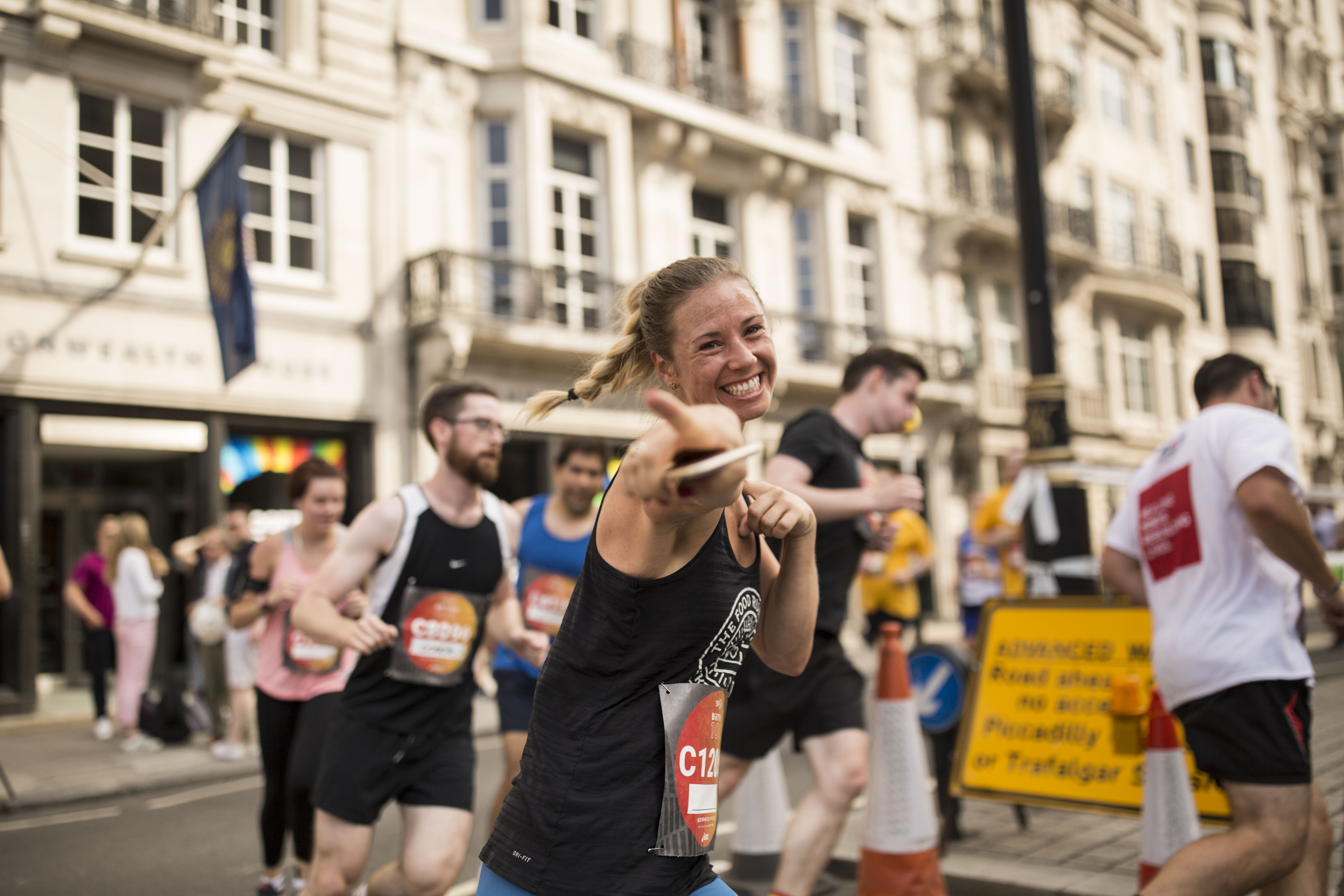 A lady running through Westminster, London, as part of the Asics London 10k race