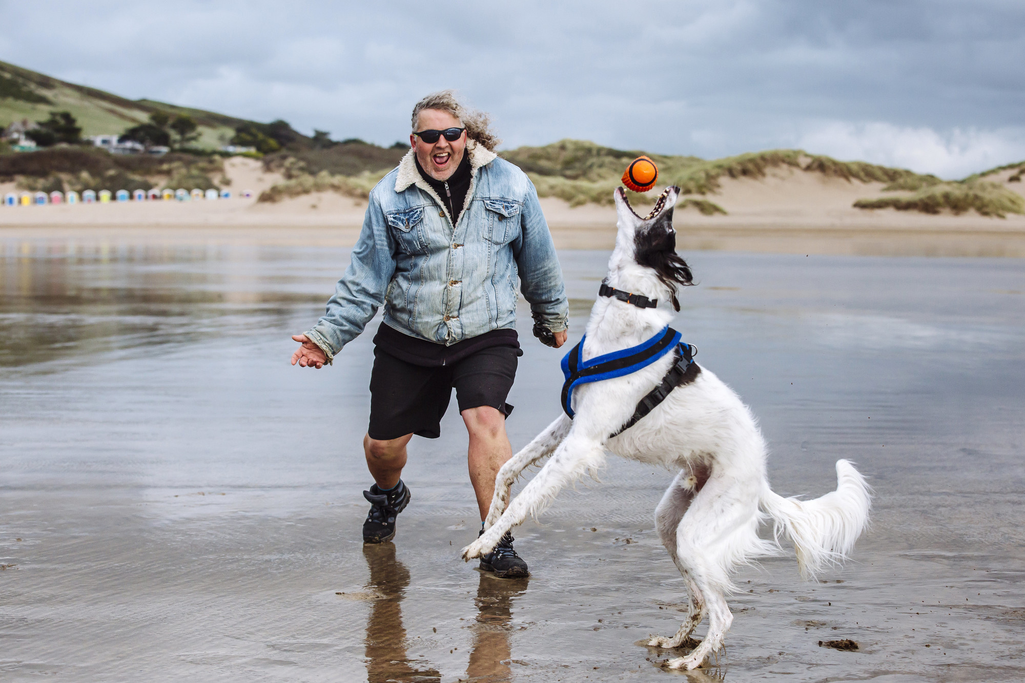 Vader with Mark on the beach playing ball