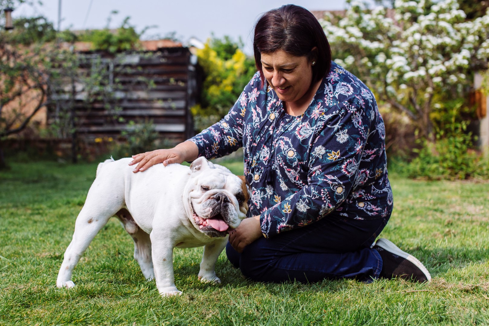 Dennis outside in garden getting a fuss from Annie