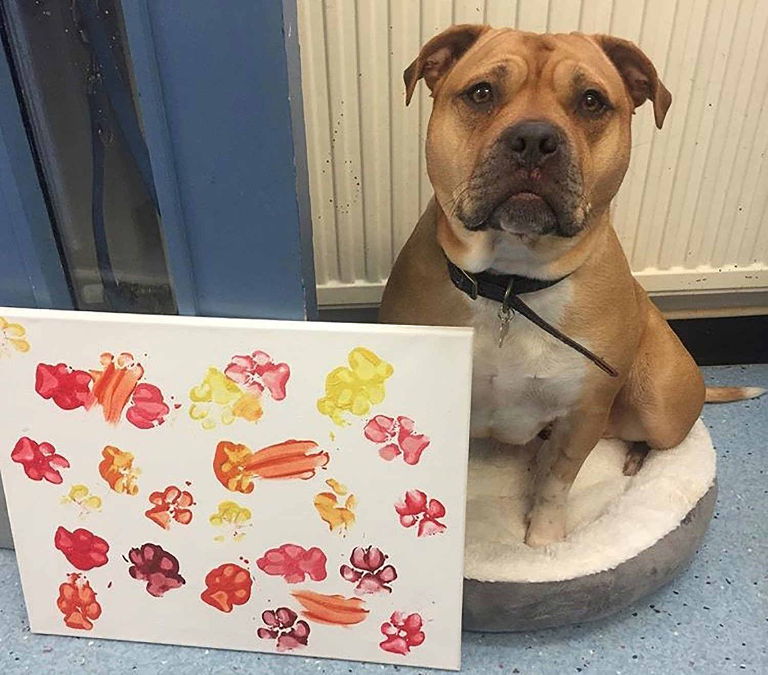 Bumble posing with her artwork