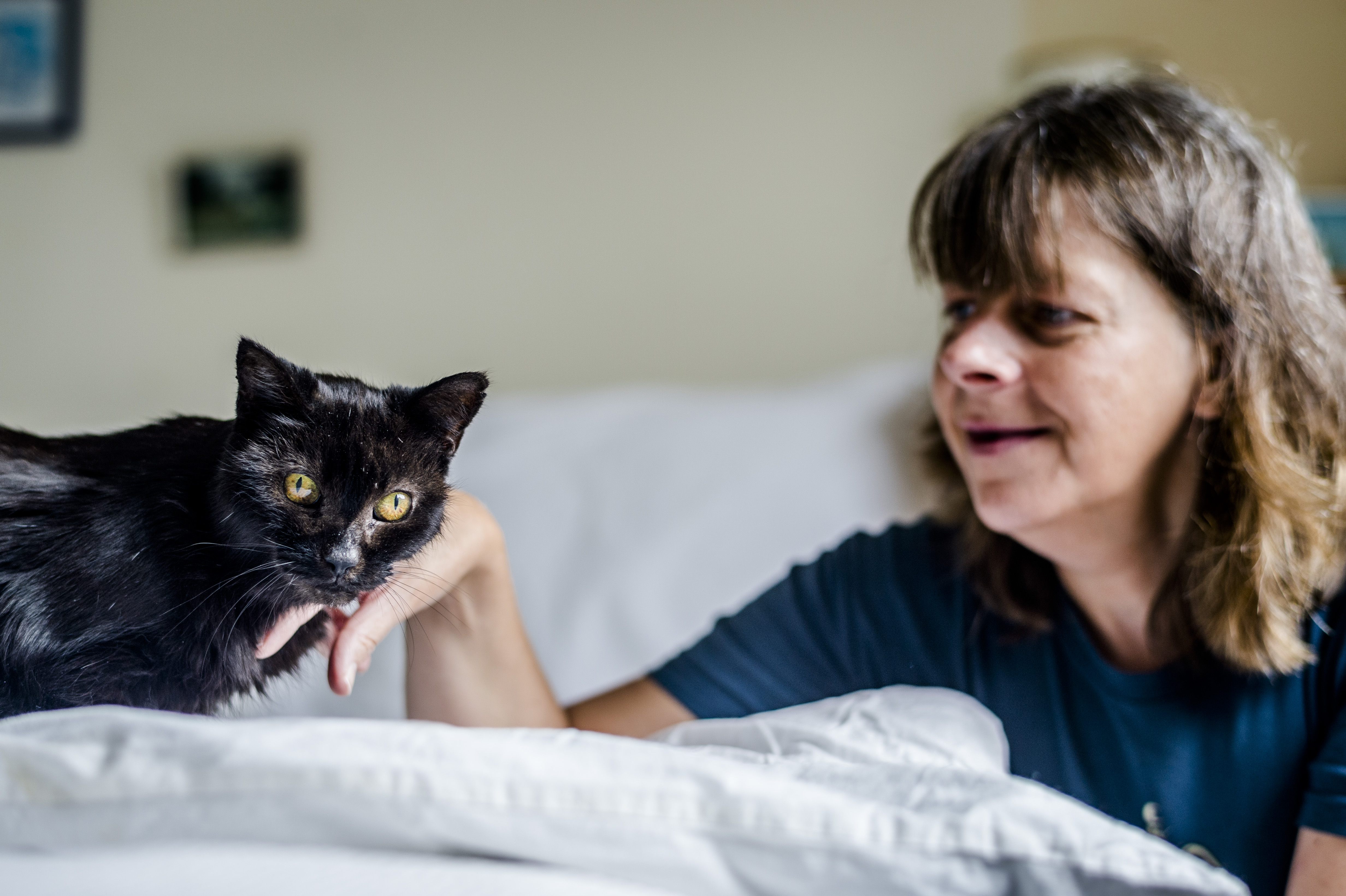 Cat Charcoal with her new owner, Elaine