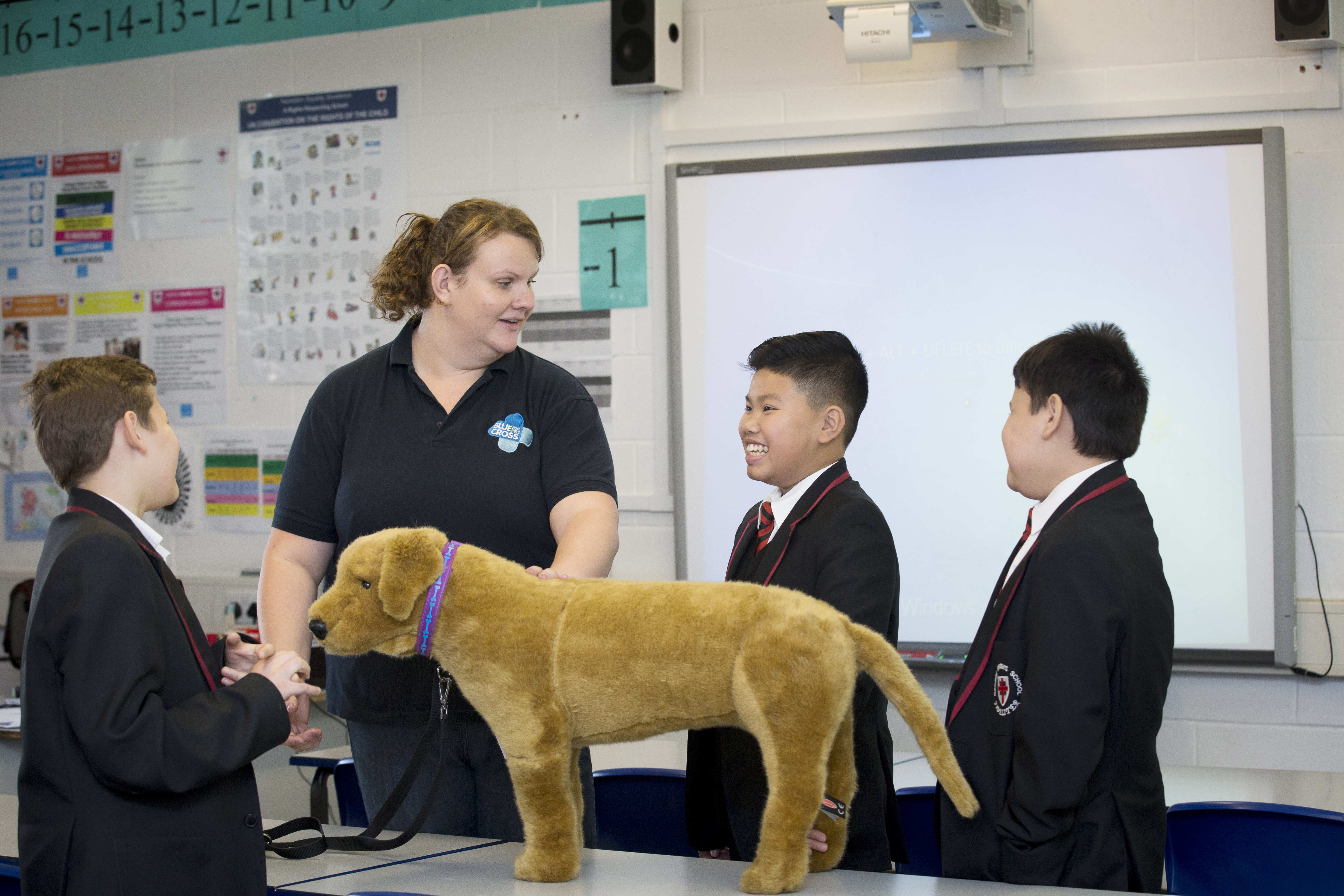 Education Officer Kaye with school children learning about dog safety