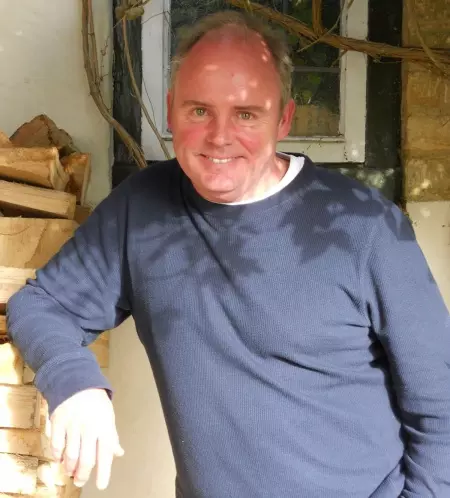 Man smiling with blue jumper