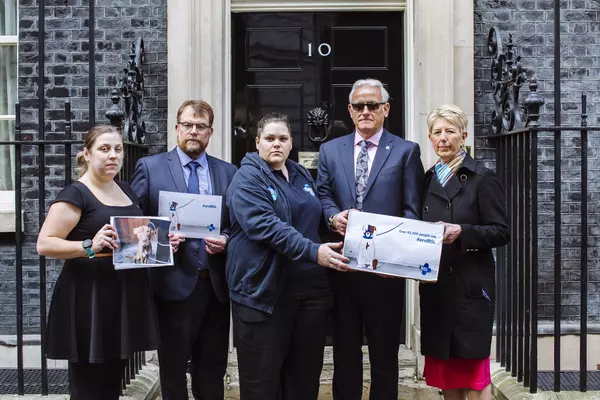 Five people standing in front of Number 10 