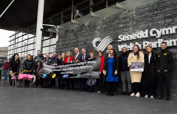Members of the Senedd pose for a group photo to celebrate joining the 'Cut the Chase' coalition.