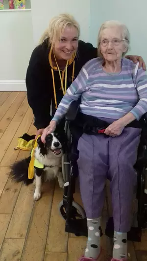 Family members with their pet Border Collie
