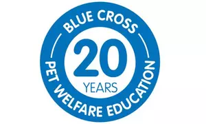 A blue and white logo with a roundel that reads 'Blue Cross, 20 years, pet welfare education' 