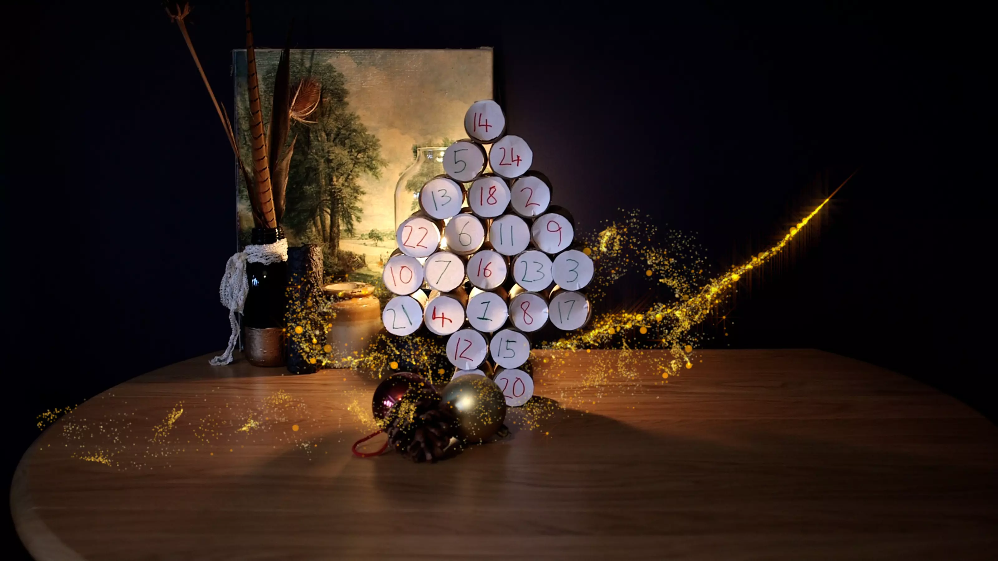 A Christmas tree made of toilet rolls, decorated with the numbers one to 24