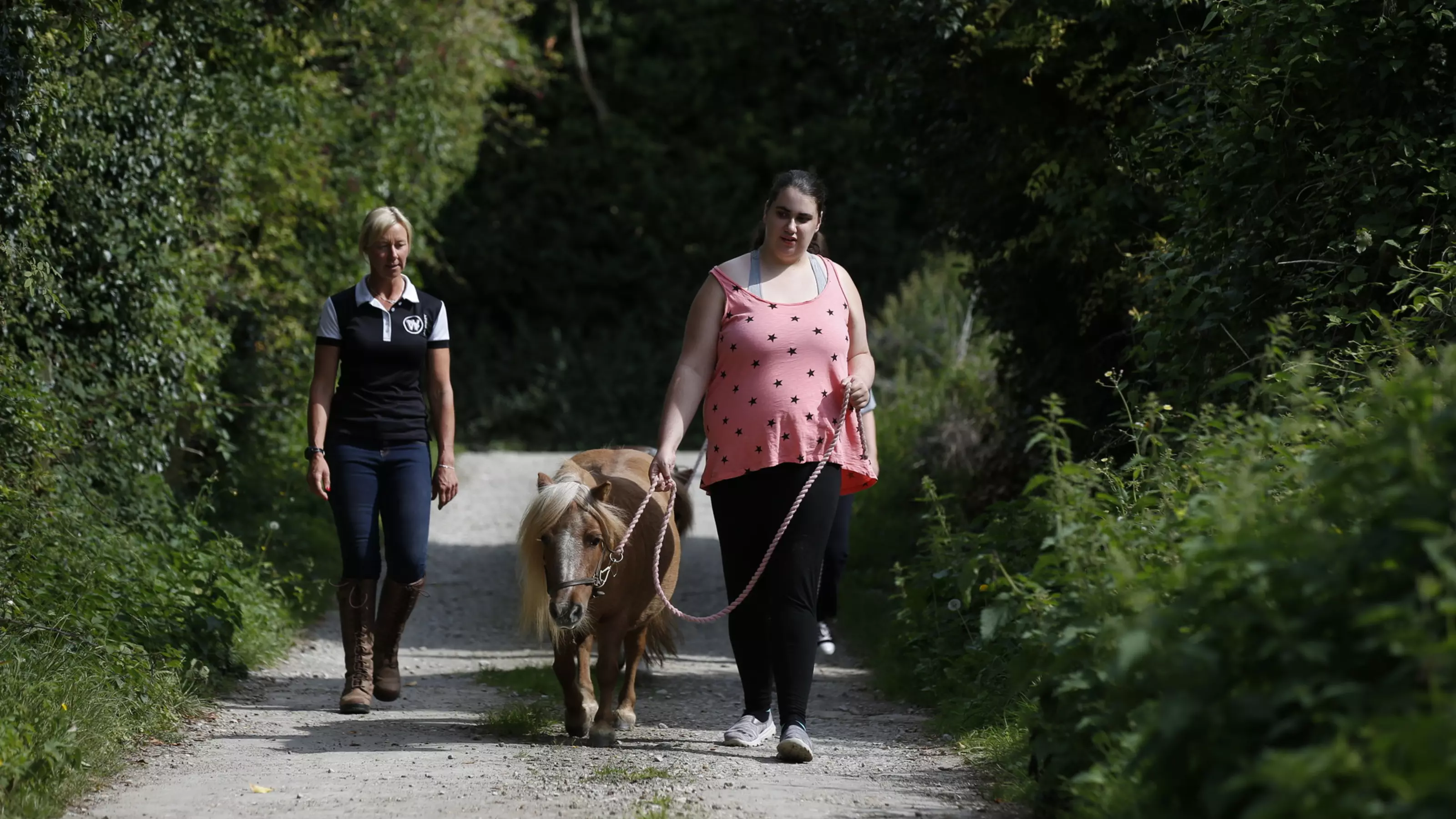 Katy leads Rose along with Suzanne