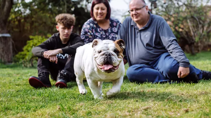 Dennis outside in the garden with Annie, Paul and Ronnie