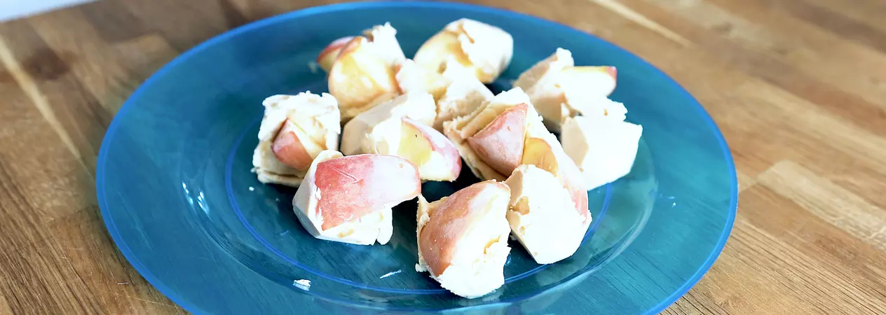 Apple and peanut butter frozen bites on a plate