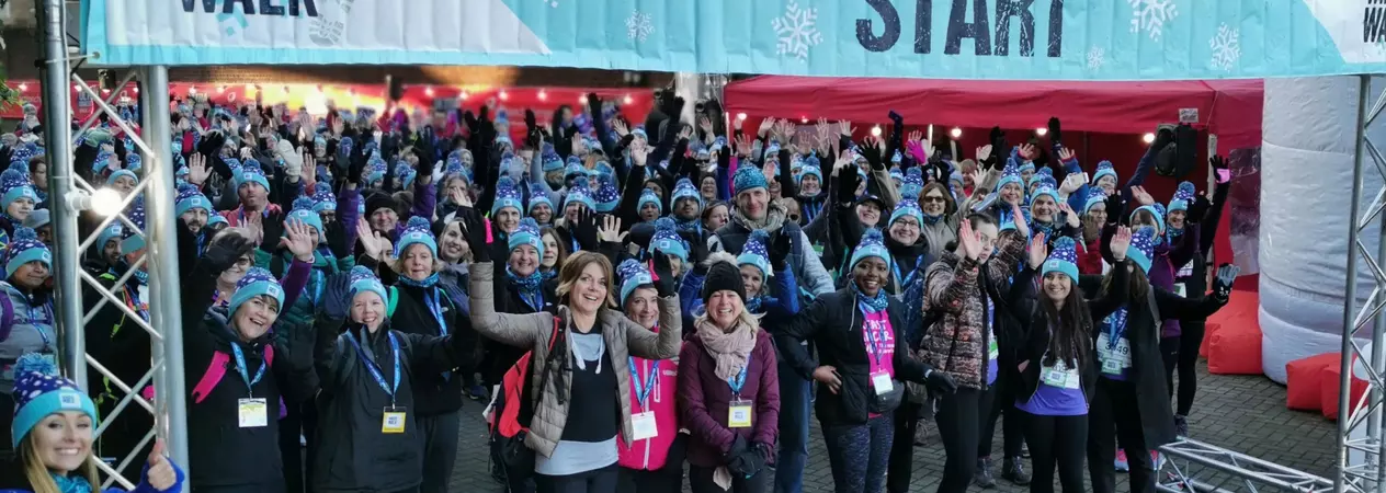 A group of people at the starting line of London Winter Walk.
