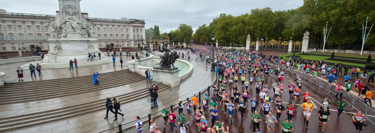 Marathon runners running past Buckingham Palace as part of the Royal Park half 