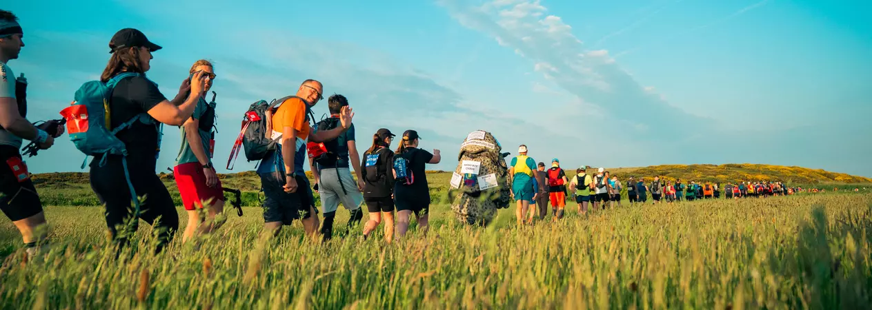 A group of trekkers walking through the lake district to fundraise for Blue Cross